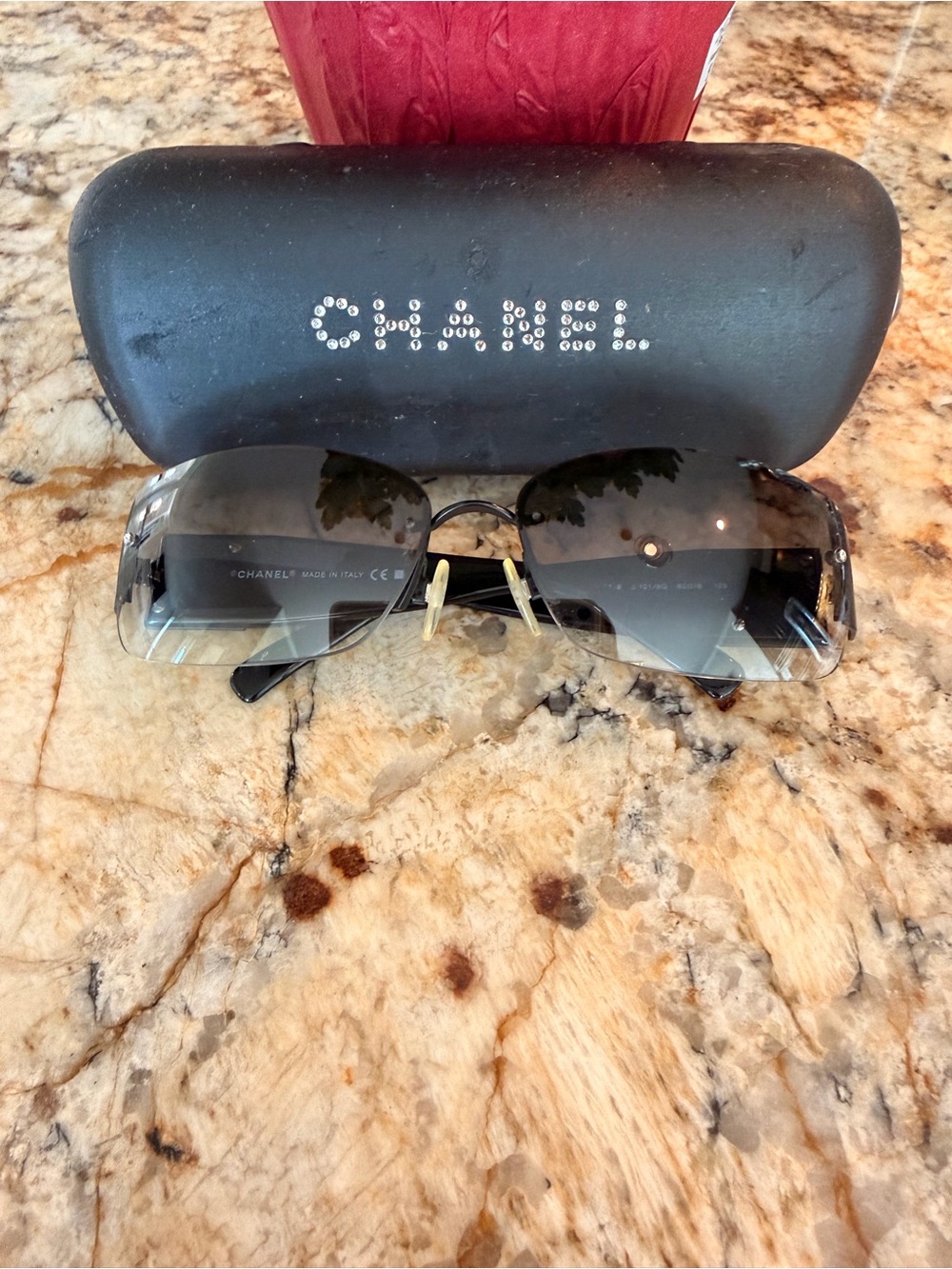 CHANEL Women’s Black Gradient Lens Rimless Sunglasses with Crystal detail